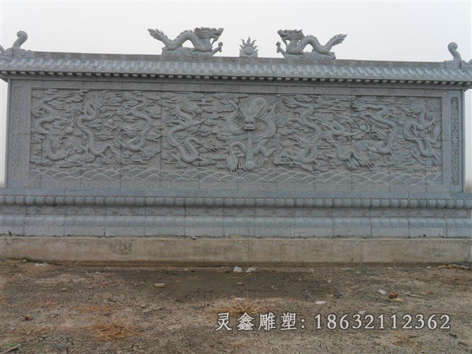 厂九龙壁石凳-营口石雕九龙壁雕塑厂灵鑫石材厂是一家景观雕塑设计