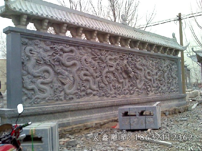 青石九龙壁-忻州石雕九龙壁雕塑制作